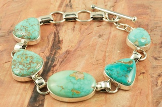 Stunning Bracelet featuring Genuine Carico Lake Turquoise set in Sterling Silver. The Carico Lake Turquoise Mine is located South of Battle Mountain in Lander County, Nevada. Created by Navajo Artist Tony Garcia. Signed by the artist.
